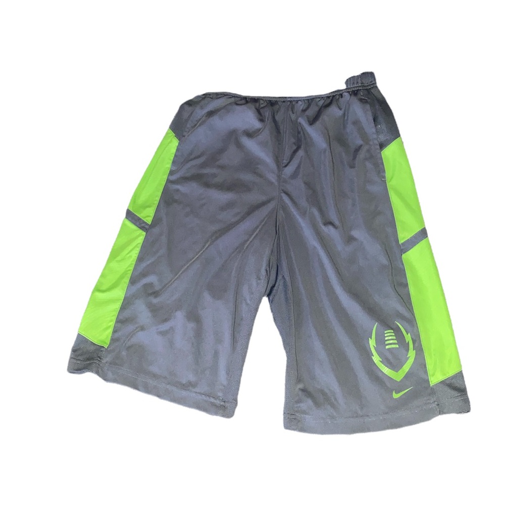 Grey and green nike football shorts